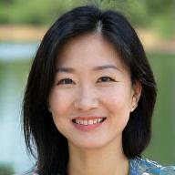 Portrait of Sarah Chen, a vibrant artist and angler, smiling confidently.