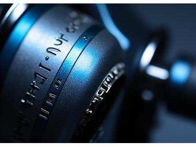 Fishing reel with custom engraving of a treble clef and musical notes